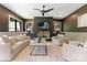 Sophisticated living room with a modern fireplace, textured walls, and comfortable seating at 3416 Windsor Dr, Charlotte, NC 28209