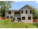 A well maintained backyard featuring a covered outdoor fireplace, perfect for entertaining and relaxation at 3416 Windsor Dr, Charlotte, NC 28209