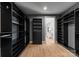 Spacious walk-in closet with custom shelving, drawers, and ample storage space, providing an organized dressing area at 3416 Windsor Dr, Charlotte, NC 28209