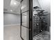 Contemporary wine cellar with custom shelving and glass door, offering stylish storage at 3416 Windsor Dr, Charlotte, NC 28209