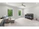 A peaceful Bedroom featuring neutral tones, a rocking chair, and two bright windows at 406 Morrison Farm Rd, Troutman, NC 28166