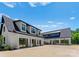 Spacious garage featuring multiple bays with black framed glass doors and ample parking at 406 Morrison Farm Rd, Troutman, NC 28166