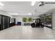 Spacious garage featuring a utility vehicle, epoxy floors, and abundant storage at 406 Morrison Farm Rd, Troutman, NC 28166