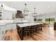 Bright, open kitchen with a large island, modern lighting, and stainless steel appliances at 406 Morrison Farm Rd, Troutman, NC 28166
