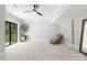 Bright living room with plush carpeting, a decorative mirror, and patio access to the outdoors at 406 Morrison Farm Rd, Troutman, NC 28166