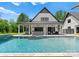 Beautiful pool and outdoor entertaining area with covered patio, bar, and spa at 406 Morrison Farm Rd, Troutman, NC 28166