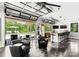 Pool house with retractable doors opening to the pool, bar area, and modern furnishings at 406 Morrison Farm Rd, Troutman, NC 28166