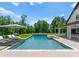 A refreshing swimming pool surrounded by lush landscaping and lounge chairs at 406 Morrison Farm Rd, Troutman, NC 28166
