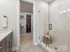 Modern bathroom with glass shower and linen closet at 408 Old Town Village Rd, Waxhaw, NC 28173