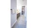 Modern bathroom with double vanity, neutral color palette, and walk-in closet at 408 Old Town Village Rd, Waxhaw, NC 28173