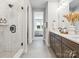 Modern bathroom with glass shower, dual vanity, and linen closet at 408 Old Town Village Rd, Waxhaw, NC 28173