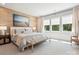 Serene bedroom featuring a wood accent wall and beach themed painting at 408 Old Town Village Rd, Waxhaw, NC 28173