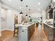Spacious kitchen with a large island, modern appliances, and an open layout, great for cooking and entertaining guests at 408 Old Town Village Rd, Waxhaw, NC 28173