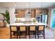 Bright kitchen featuring a quartz island with seating and modern stainless-steel appliances at 408 Old Town Village Rd, Waxhaw, NC 28173