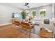 Bright living room with large windows, modern furnishings, and hardwood floors at 408 Old Town Village Rd, Waxhaw, NC 28173