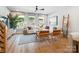 Bright living room with hardwood floors, white sofa, and large windows at 408 Old Town Village Rd, Waxhaw, NC 28173
