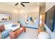 Living room with neutral paint, modern decor, a ceiling fan, TV, and comfortable seating at 408 Old Town Village Rd, Waxhaw, NC 28173