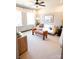 Cozy living room with a ceiling fan, large windows, neutral decor, and stylish furniture at 408 Old Town Village Rd, Waxhaw, NC 28173