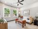 Cozy living room with lots of natural light from large windows, and a ceiling fan at 408 Old Town Village Rd, Waxhaw, NC 28173