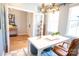 Home office featuring a modern chandelier, workspace, and ample natural light from a window at 408 Old Town Village Rd, Waxhaw, NC 28173