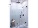 Bright shower with a frameless glass door, modern fixtures, and tiled walls at 408 Old Town Village Rd, Waxhaw, NC 28173