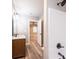 Modern bathroom boasts a wood cabinet and a stylish shower with a dark shower head at 4221 E Maiden Rd, Maiden, NC 28650