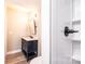 Contemporary bathroom features a black vanity and white-tiled shower with modern fixtures at 4221 E Maiden Rd, Maiden, NC 28650