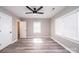 Bright bedroom featuring wood floors, a ceiling fan, and natural light at 4221 E Maiden Rd, Maiden, NC 28650