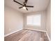 Bedroom with modern ceiling fan, window, and neutral color paint at 4221 E Maiden Rd, Maiden, NC 28650