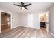 Modern bedroom with wood floors, neutral walls, and an attached bathroom visible at 4221 E Maiden Rd, Maiden, NC 28650