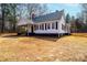 Exterior of a well-kept single-story house with a classic design and landscaped yard at 4221 E Maiden Rd, Maiden, NC 28650