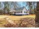 Exterior of a charming home with a covered front porch, and mature landscaping at 4221 E Maiden Rd, Maiden, NC 28650