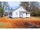 Exterior showcasing a neatly maintained yard and small deck, creating a welcoming outdoor space at 4221 E Maiden Rd, Maiden, NC 28650