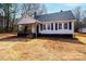 Charming exterior of a single-story home featuring a cozy front porch and classic architectural details at 4221 E Maiden Rd, Maiden, NC 28650