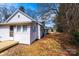 Exterior view featuring the side of the house, displaying the small deck, and well-kept yard at 4221 E Maiden Rd, Maiden, NC 28650