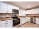 Modern kitchen features white cabinets, stainless steel appliances, and wood countertops at 4221 E Maiden Rd, Maiden, NC 28650
