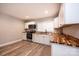 Modern kitchen features hardwood floors, white cabinets, wood countertops and stainless steel appliances at 4221 E Maiden Rd, Maiden, NC 28650