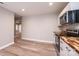 Bright kitchen features hardwood floors, white cabinets, and modern stainless steel appliances at 4221 E Maiden Rd, Maiden, NC 28650
