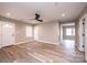 Bright living room with wood floors and a modern ceiling fan fixture at 4221 E Maiden Rd, Maiden, NC 28650