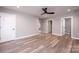 Neutral living room with hardwood flooring and an open floor plan, modern ceiling fan at 4221 E Maiden Rd, Maiden, NC 28650