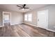 Bright living room with new flooring, and a stylish front door, offering a comfortable and modern living space at 4221 E Maiden Rd, Maiden, NC 28650
