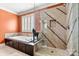 A spa-like bathroom featuring a soaking tub, glass enclosed shower with tan and brown tiling, and a horse statue at 4340 Rodeway Ne Ct, Hickory, NC 28601