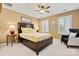 Cozy bedroom featuring a ceiling fan, shuttered windows, a full sized bed and classic decor at 4340 Rodeway Ne Ct, Hickory, NC 28601
