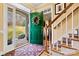 Inviting entryway with a decorative green door, beautiful hardwood floors, and stairs leading to the upper level at 4340 Rodeway Ne Ct, Hickory, NC 28601