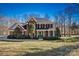 Beautiful brick home with manicured lawn, lush landscaping and a welcoming columned entryway at 4340 Rodeway Ne Ct, Hickory, NC 28601