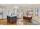 Bright kitchen features an island with wine storage and hardwood floors at 4340 Rodeway Ne Ct, Hickory, NC 28601