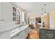 Sunlit kitchen featuring white cabinets, granite countertops, and stainless appliances at 4340 Rodeway Ne Ct, Hickory, NC 28601
