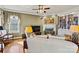 Relaxing living room with hardwood floors, fireplace, ceiling fan, and a built-in bookcase at 4340 Rodeway Ne Ct, Hickory, NC 28601