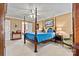 The main bedroom has a four-poster bed and carpet flooring at 4340 Rodeway Ne Ct, Hickory, NC 28601