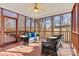 Relaxing screened porch with comfortable seating and an outdoor ceiling fan at 4340 Rodeway Ne Ct, Hickory, NC 28601